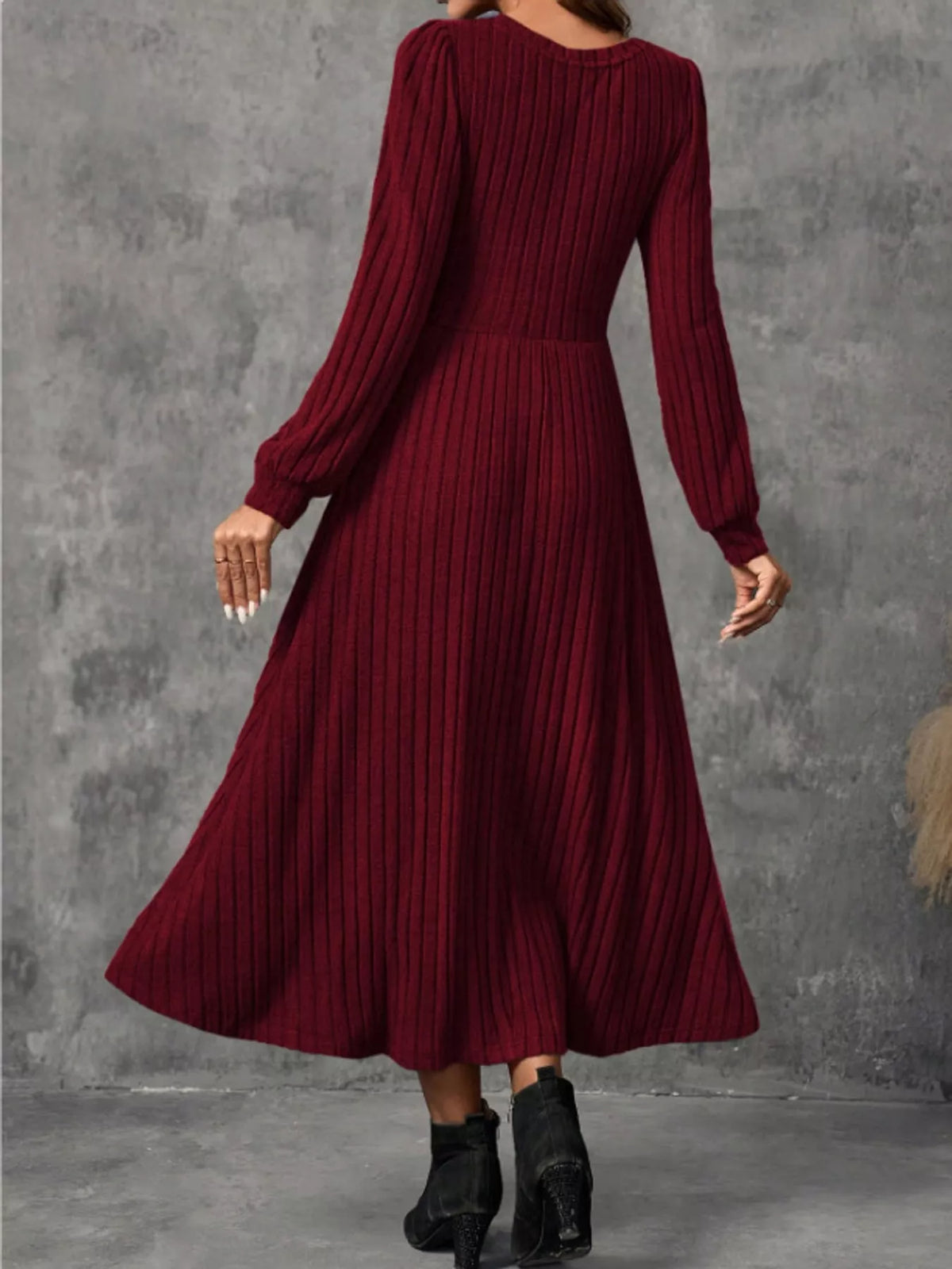 Burgundy ribbed knit long-sleeve A-line midi dress, back view on model.