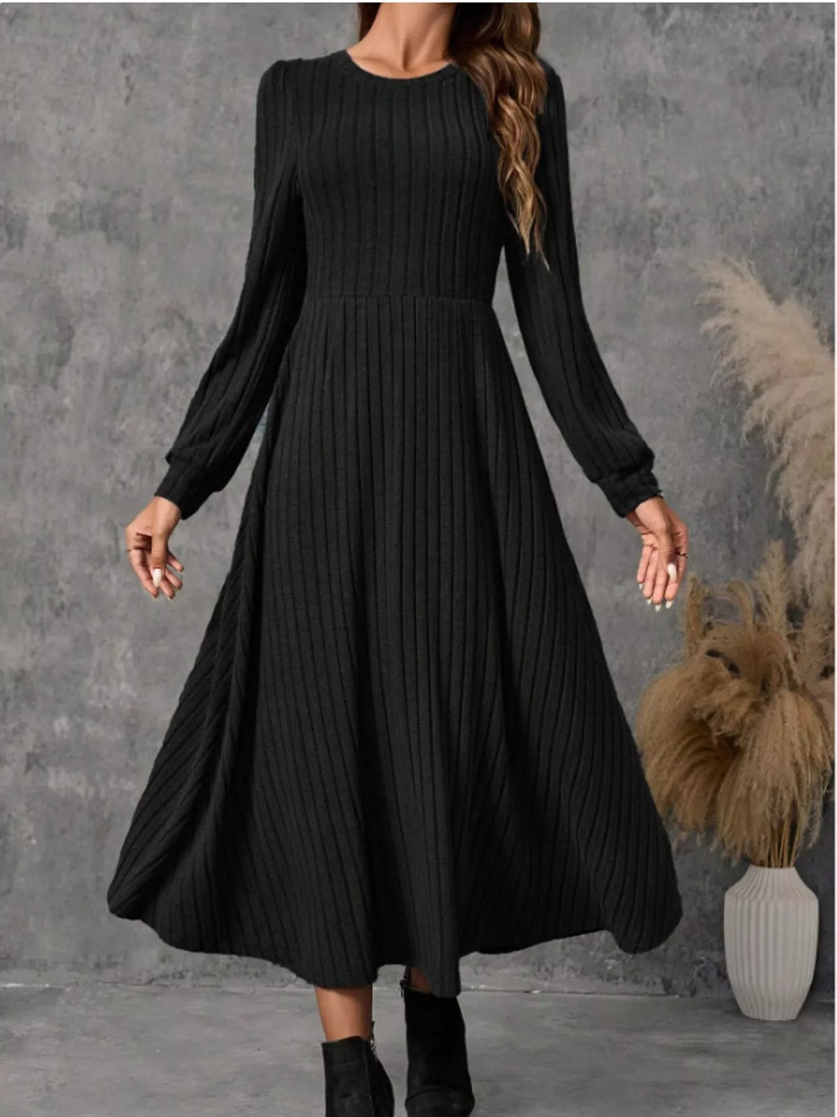 Black ribbed knit long-sleeve A-line midi dress, front view on model.