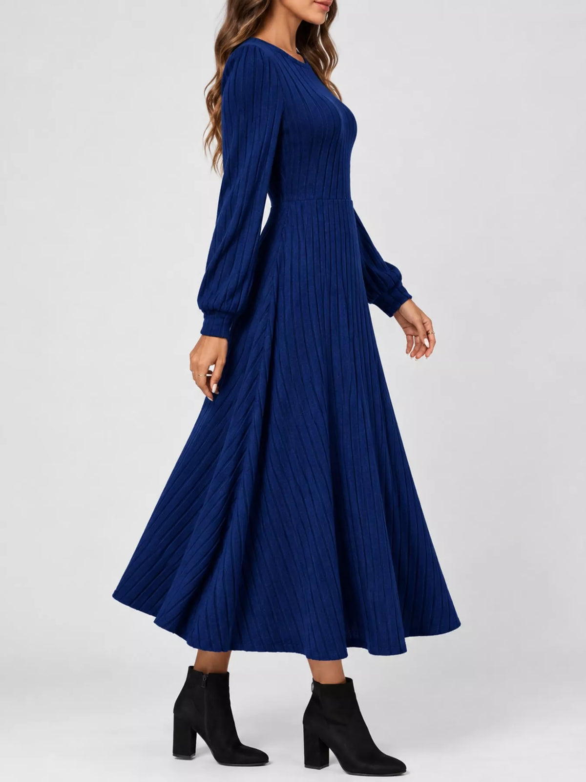 Royal Blue ribbed knit long-sleeve A-line midi dress, side view on model against a white background.