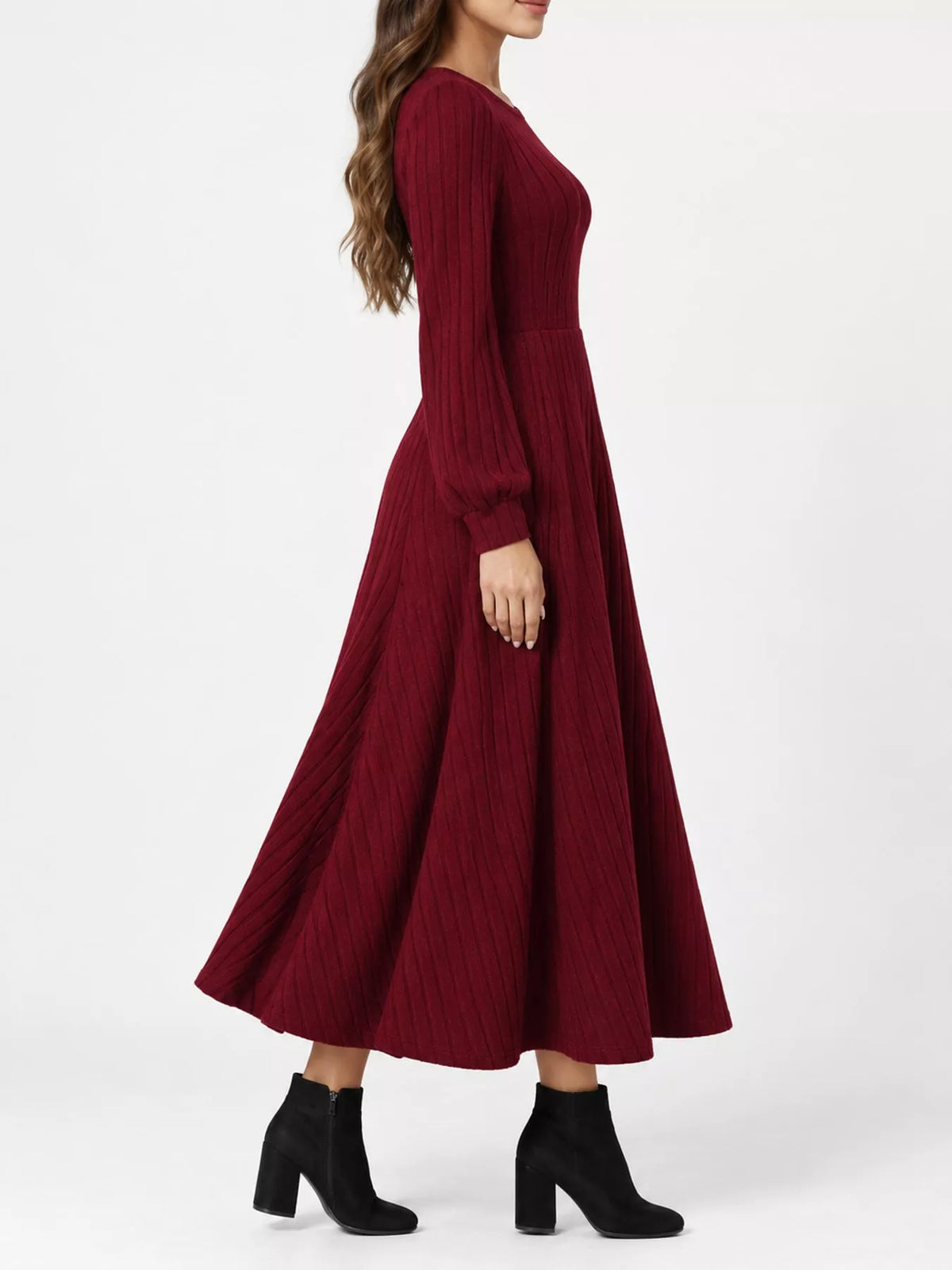 Burgundy ribbed knit long-sleeve A-line midi dress, side view on model against a white background.